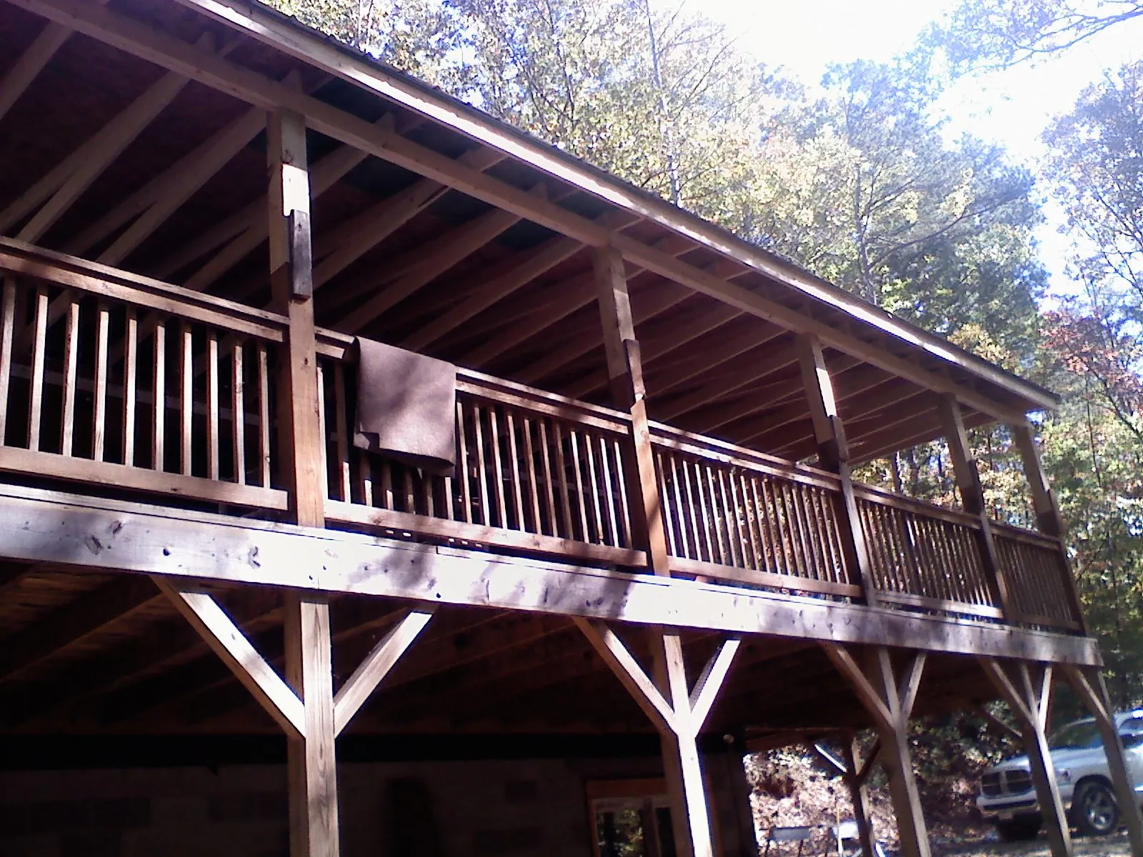 Timber framing under a new elevated porch and deck — Roof Leak Repair in New London by Roofing Brothers
